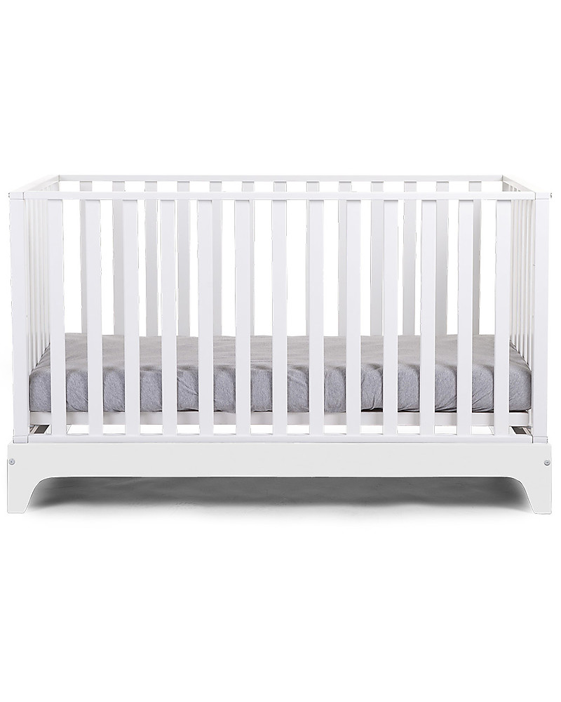 white cot and mattress